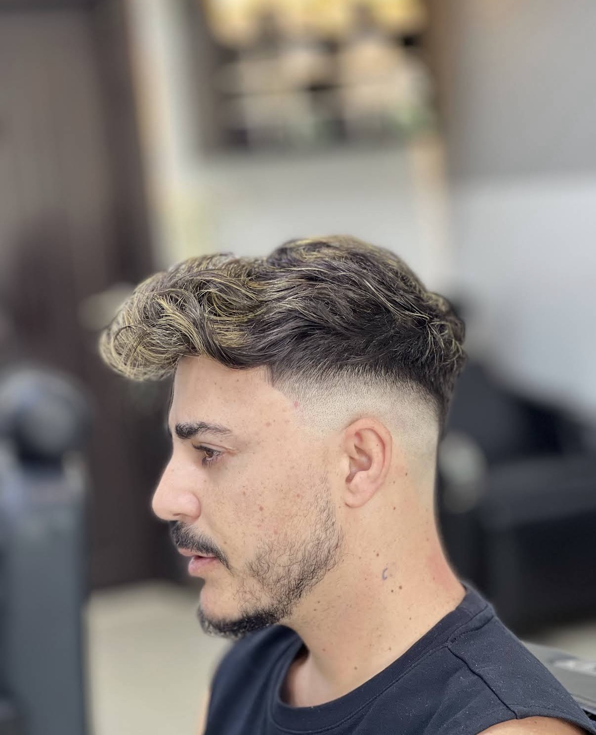 Textured fade haircut, side view